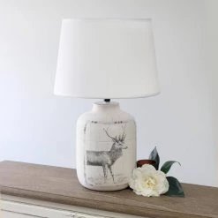 17 in. 1-Light Rustic Deer Buck Nature Printed Ceramic Farmhouse Accent Table Lamp with Fabric Shade by Simple Designs 14 17 in. 1-Light Rustic Deer Buck Nature Printed Ceramic Farmhouse Accent Table Lamp with Fabric Shade by Simple Designs -Simple Designs Online Shop white wash simple designs table lamps lt1065 der 76 1000